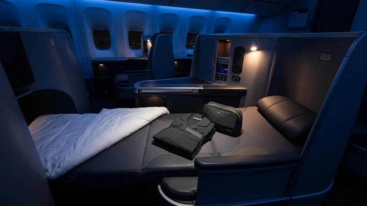 Airline business class pyjamas and amenity kit on leather seat