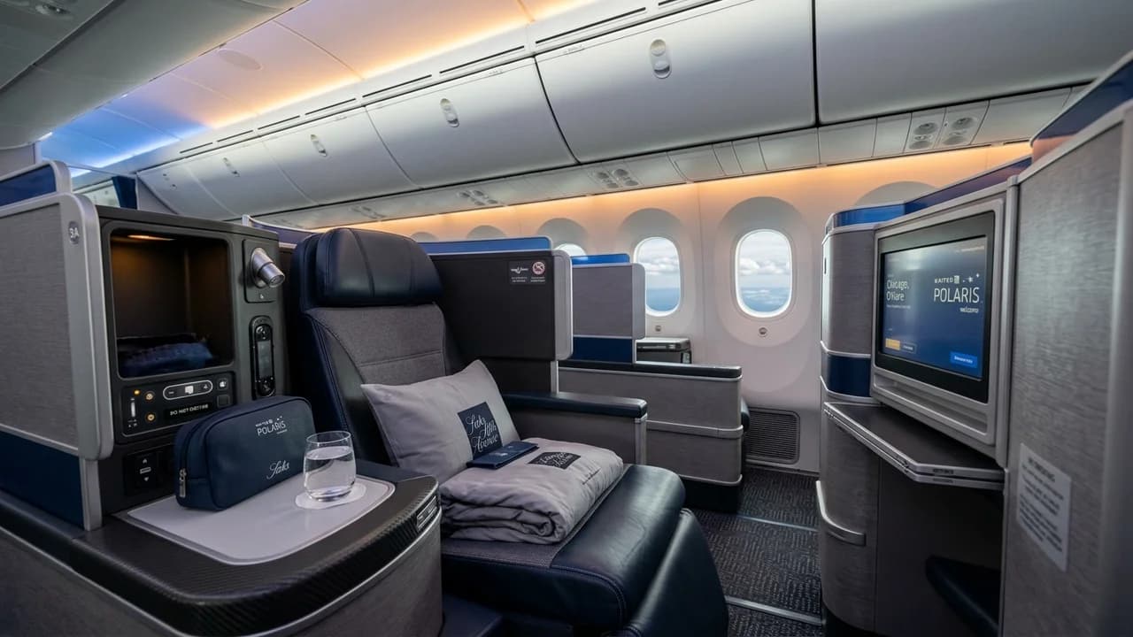 United business class cabin with lie-flat suite and premium amenities