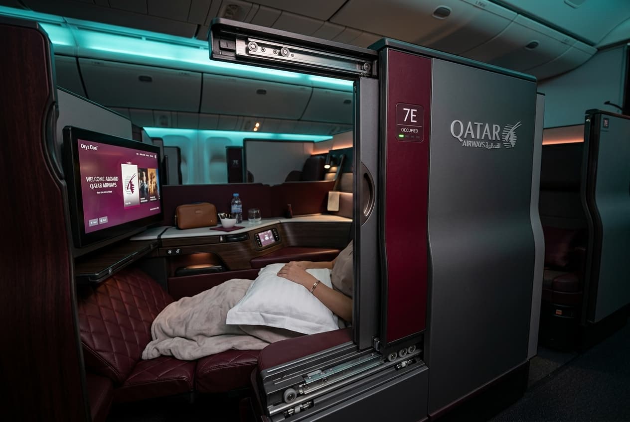 Qatar Airways QSuite business class suite with sliding privacy door