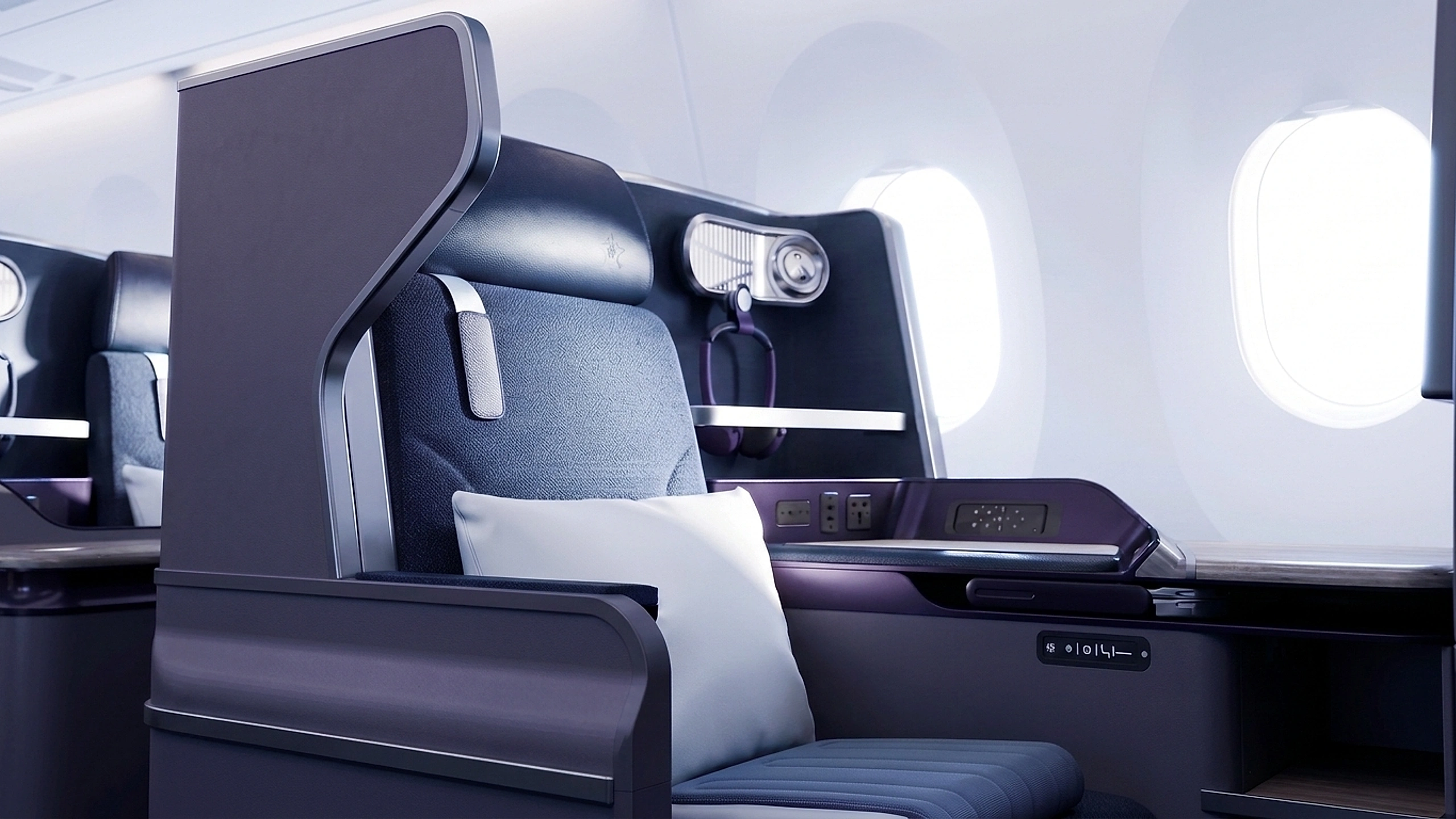 Premium business class suite with panoramic windows and warm cabin lighting